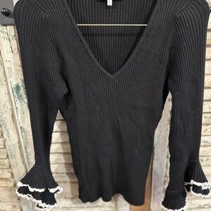 Black Ribbed V-Neck Sweater with Ruffle Cuffs
